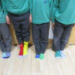 children wearing multicoloured socks